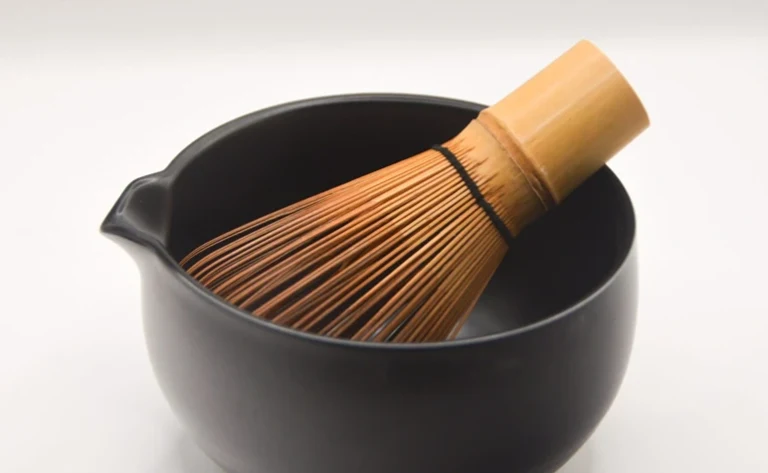 Matcha bowl, or chawan, with a bamboo matcha whisk inside.
