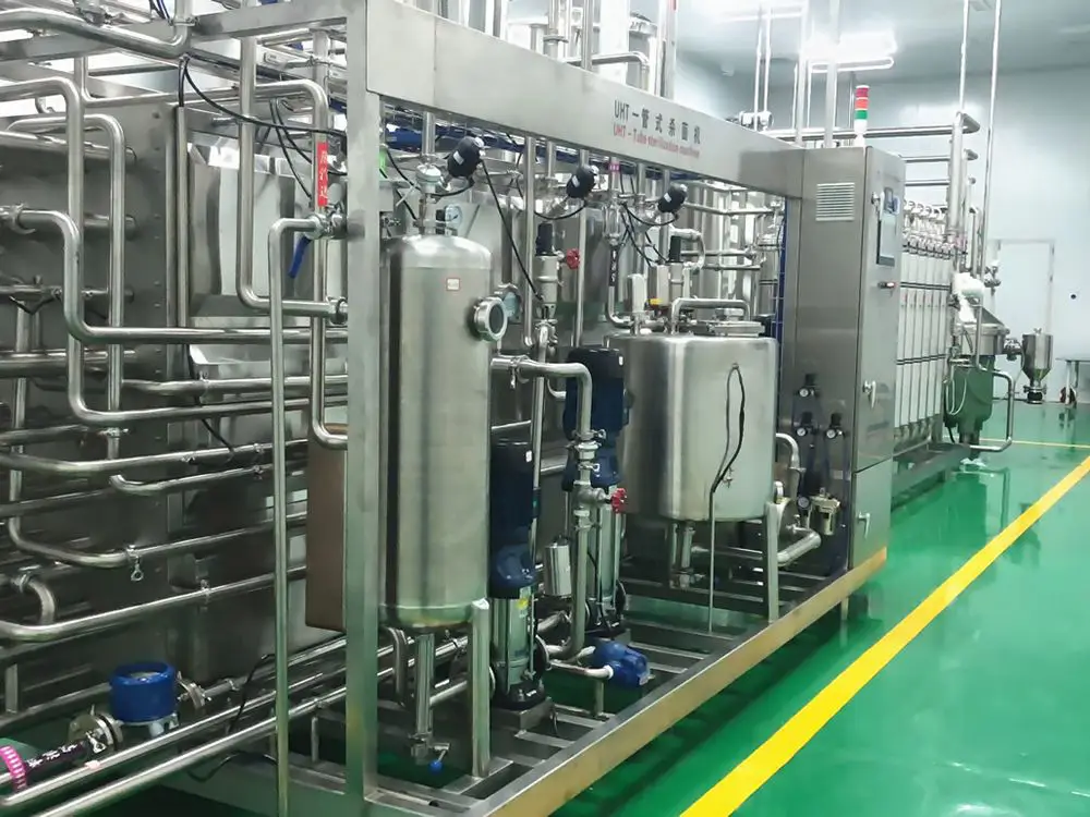 Instant tea powder factory with automated extraction and spray-drying equipment.