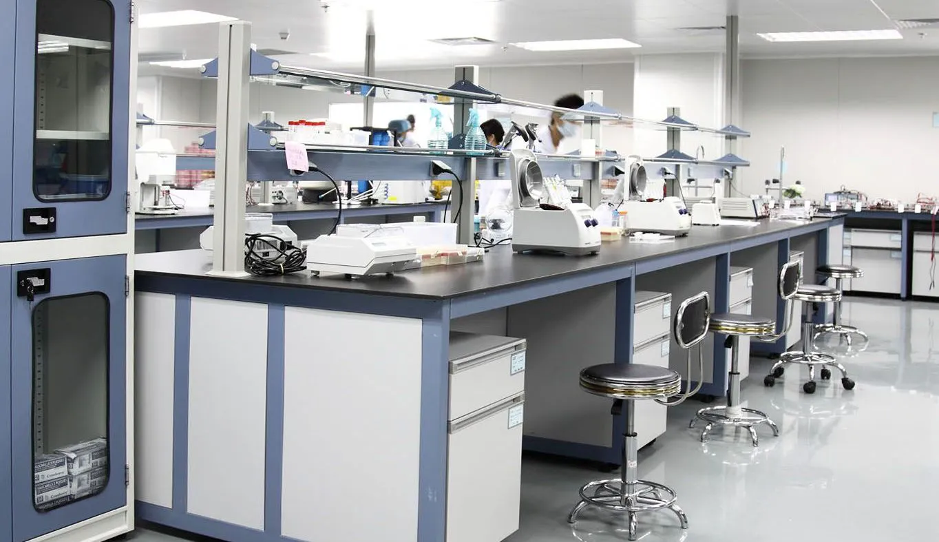 Tea R&D laboratory equipped with analytical instruments and technicians at work.